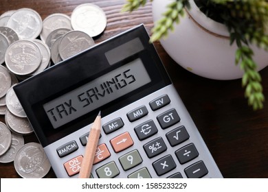Calculator with text Tax Savings.  Business, finance conceptual. 