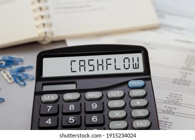 Calculator with the word cashflow on display. Business, tax and financial concept