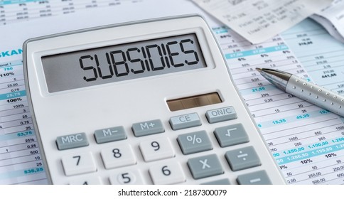 A Calculator With The Word Subsidies On The Display