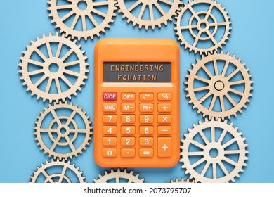 Calculator With The Word Written Engineering Equation And Gears. Engineering And Mathematics Concept