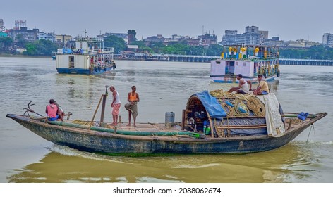 Calcutta, India - November 12 2021: Passenger Ferries And A Country Boat On The Hooghly River