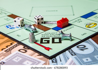 CALDWELL, IDAHO/USA - MARCH 16, 2015: Game pieces from game Monopoly sitting near the start