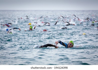 CALELLA, SPAIN - MAY 18:  Triathletes on start of the Ironman triathlon competition at Calella beach, May 18, 2014 in Calella, Spain 