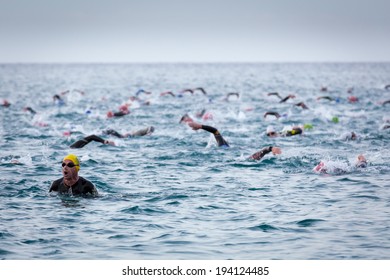 CALELLA, SPAIN - MAY 18:  Triathletes on start of the Ironman triathlon competition at Calella beach, May 18, 2014 in Calella, Spain 