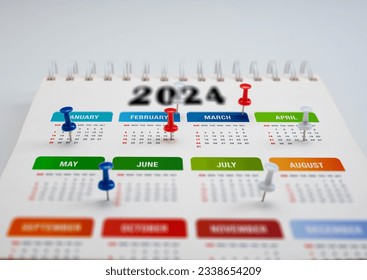 Calendar 2024 planning. colorful pin marks important dates. 2024 Planner calendar, clock to set timetable organize schedule, planning for business meeting, planning concept. - Powered by Shutterstock