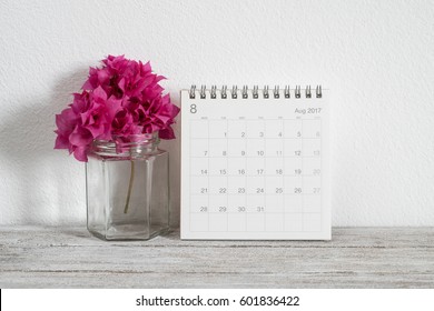 Calendar August 2017on Wooden Table With Flowers In Room Decoration