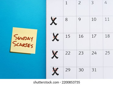 Calendar on blue background crosson Sunday with stick note SUNDAY SCARIES (Sunday blues) - feelings of intense anxiety or dread happen on day before head back to work, office or school  - Powered by Shutterstock