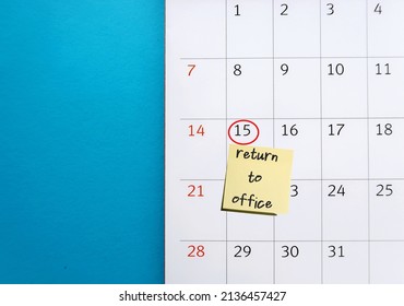 Calendar On Blue Background With Mark On Certain Date With Stick Note RETURN TO OFFICE, Concept Of Employers Recalling Employees Back To Workplace After Pandemic Working From Home