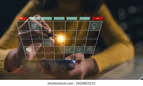 Calendar on the virtual screen interface. Businesswomen manage time for effective work. Highlight appointment reminders and meeting agendas on the calendar. Time management concept.