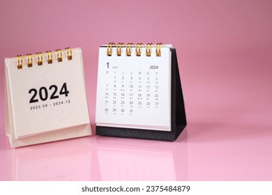 Calendar page January of the year 2024 white color in pink backgroud. with copy space and business design. concept of planning and setting new strategic goals. - Shutterstock ID 2375484879