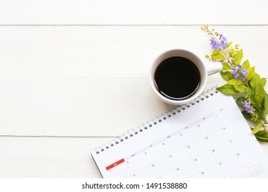 calendar planner with hot coffee of lifestyle at office arrangement flat lay style on background white 