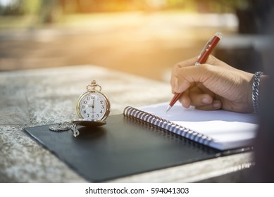 Calendar Reminder Event Concept.Female Hand Planner,organizer Writing Appointment ,woman Mark And Noted Schedule On Book Or Diary At Desk.Count Down Day On Calender.On Table Have Vintage Watch Pocket