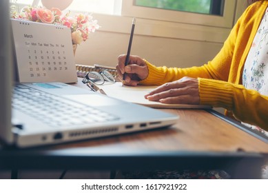 Calendar Reminder Event Concept.Woman Hand Planner Or Organizer Writing On Diary Book And 2020 Calendar Page.Student Planning Appointment,noted And Count Down Schedule Day