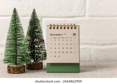 The calendar shows December 2024. Desktop desk calendar. Hello, December - Powered by Shutterstock