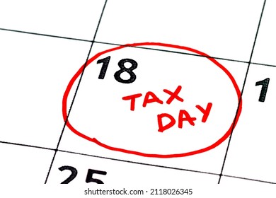 Calendar with words Tax Day showing tax day for filing is April 18. Close up
