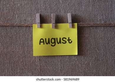 Calendar year 2017, month and day,written on a wooden table and paper sticky notes.