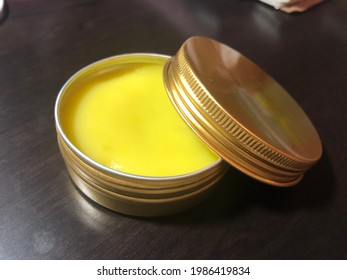Calendula salve in gold tin - Shutterstock ID 1986419834