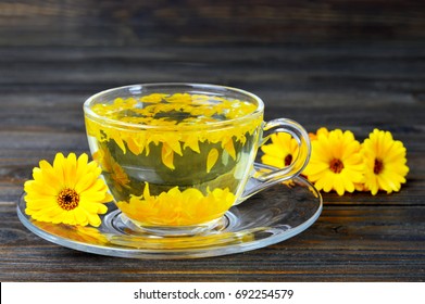 Calendula Tea On Wooden Background