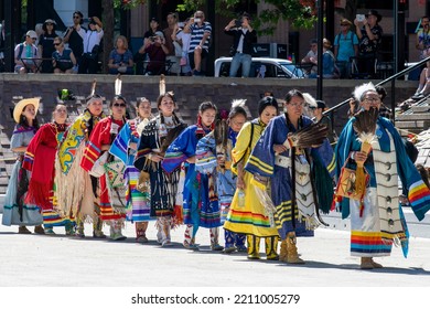 Calgary, AB, Canada-August 2022; Close Up Of Group Of Colorful Woman In Long Line For Indigenous Culture Performance By Indians At Olympic Plaza During The Calgary Stampede Days