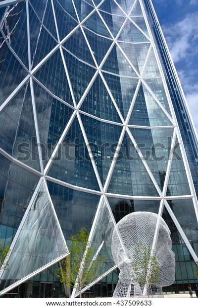 CALGARY, AB- MAY 29:\
The Bow Building and the Wonderland Sculpture on May 29 2016 in\
Calgary, AB. Calgary has prominent buildings in a variety of styles\
by many famous\
architects.