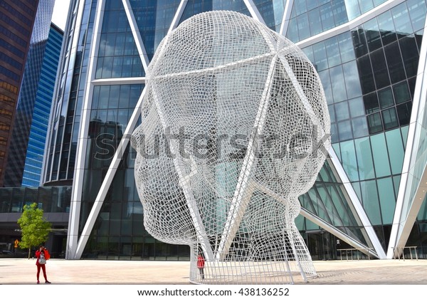 CALGARY, AB- MAY 29:\
The Bow Building and the Wonderland Sculpture on May 29 2016 in\
Calgary, AB. Calgary has prominent buildings in a variety of styles\
by many famous\
architects.