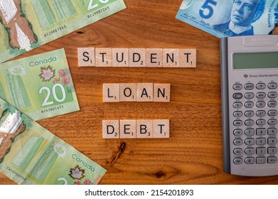 Calgary, Alberta - April 21, 2022: Cancel student debt concept with american dollars.