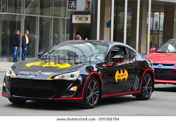 Calgary, Alberta, Canada, April 24 2014: Comic and\
Entertainment Expo Parade Batman themed Scion in parade proceeding\
Calgary Comic Expo
