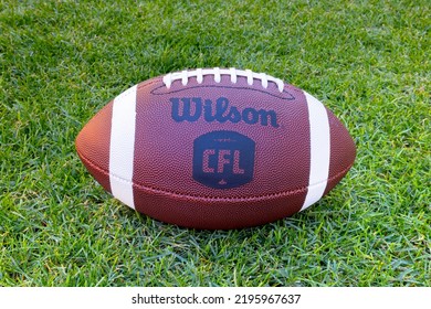 Calgary, Alberta, Canada. Aug 30, 2022. A Canadian Football League Ball  With The CFL Logo On A Green Grass Field. 