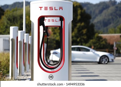 Calgary, Alberta / Canada - August 23rd 2019 : Photograph of a white Tesla model 3 charging through the supercharger.