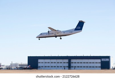 Calgary, Alberta, Canada. February 11, 2022. A Central Mountain Air  De Havilland Canada DHC-8-300 with identification C-GBCT preparing to land at Calgary International Airport