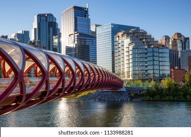 Calgary, Alberta, Canada - June 18, 2018: Peace Bridge across Bow River during a vibrant summer sunrise.