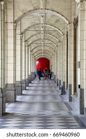 Calgary. Alberta. Canada.  June 29 2017.  Red Ball Project In Calgary Stephen Avenue's Hudson Bay.  Pillars As Leading Lines To The Red Ball.