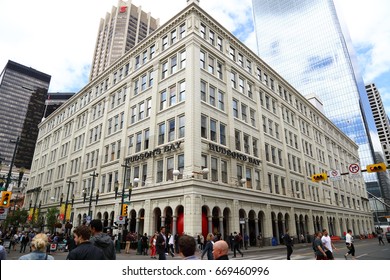 Calgary. Alberta. Canada.  June 29 2017. Red Ball Project In Calgary Downtown, Stephen Avenue.  The Ball Was Trapped Inside Hudson Bay's Pillars.