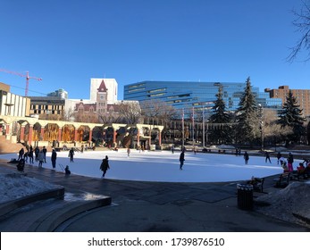 Calgary, Alberta / Canada - March 20, 2020: People Ice Skating At Olympic Plaza In Calgary Downtown