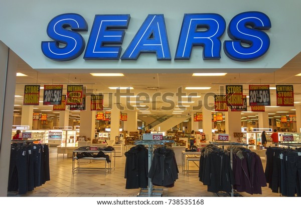 CALGARY, ALBERTA, CANADA - OCTOBER 19, 2017:\
Sears Store Front in Southcentre Shopping Mall in South Calgary\
with Liquidation Sale Deals due to upcoming Corporate Closure and\
going out of Business