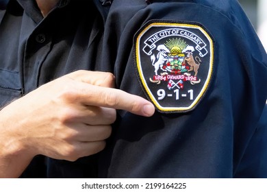 Calgary, Alberta, Canada. Sep 5, 2022. A Paramedic Staff Pointing To A Uniform 911 Batch.