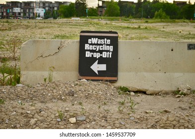 Calgary, Alberta / Canda - July 23, 2019. EWaste Recycling Drop-Off Sign With Arrow In Curie Barracks Calgary.