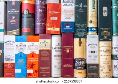 Calgary, Alberta - June 19, 2022: Single malt scotch whisky display boxes and tubes as background.