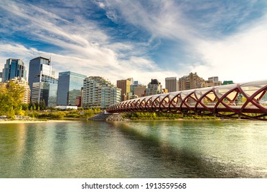 CALGARY, CANADA - APRIL 2, 2020: Peace Bridge across Bow river in Calgary in a sunny day, Canada