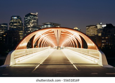 CALGARY, CANADA - AUGUST 27: Peace Bridge at night on August 27, 2015 in Calgary, Canada. Designed by Santiago Calatrava, the pedestrian bridge connect across Bow River and the landmark of the city.