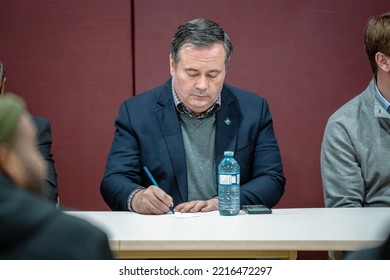 CALGARY, CANADA - Mar 13, 2022: Jason Kenney Taking Notes At A Community Town Hall Even