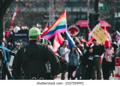 CALGARY, CANADA - Mar 20, 2022: A Public Safety Officer Keeps The Peace At A Local Peaceful Protest