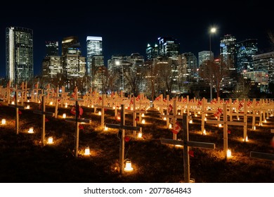 CALGARY, CANADA - Nov 11, 2021: Field Of Crosses Candle Light Vigil With The City Of Calgary In The Background