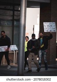 CALGARY, CANADA - Oct 17, 2021: A Group Of Four People Leaving A Nearby Protest That Occurred In Downtown Calgary, Alberta 