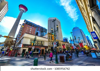 CALGARY, CANADA -SEPTEMBER 29 ,2017: Pedestrians walking past retail outlets along Stephen Ave in Autumn, Calgary, Alberta. Stephen Ave is a famous pedestrian mall in downtown Calgary