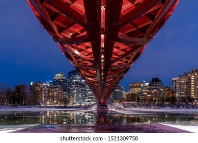 Calgary cityscape with Peace Bridge and downtown skyscrapers in Alberta at dusk, Canada.