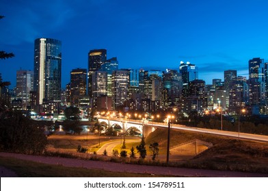 Calgary Skyline At Night With Bow River And Centre Street Bridge.