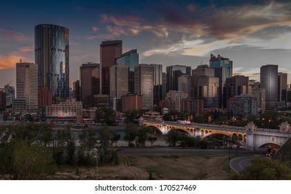 Calgary Skyline At Night With Bow River And Centre Street Bridge.