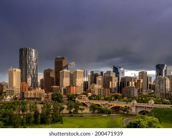 Calgary Skyline At Night With Bow River And Centre Street Bridge.