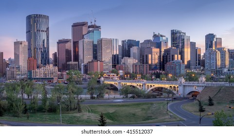 Calgary Skyline At Night With Bow River And Centre Street Bridge.